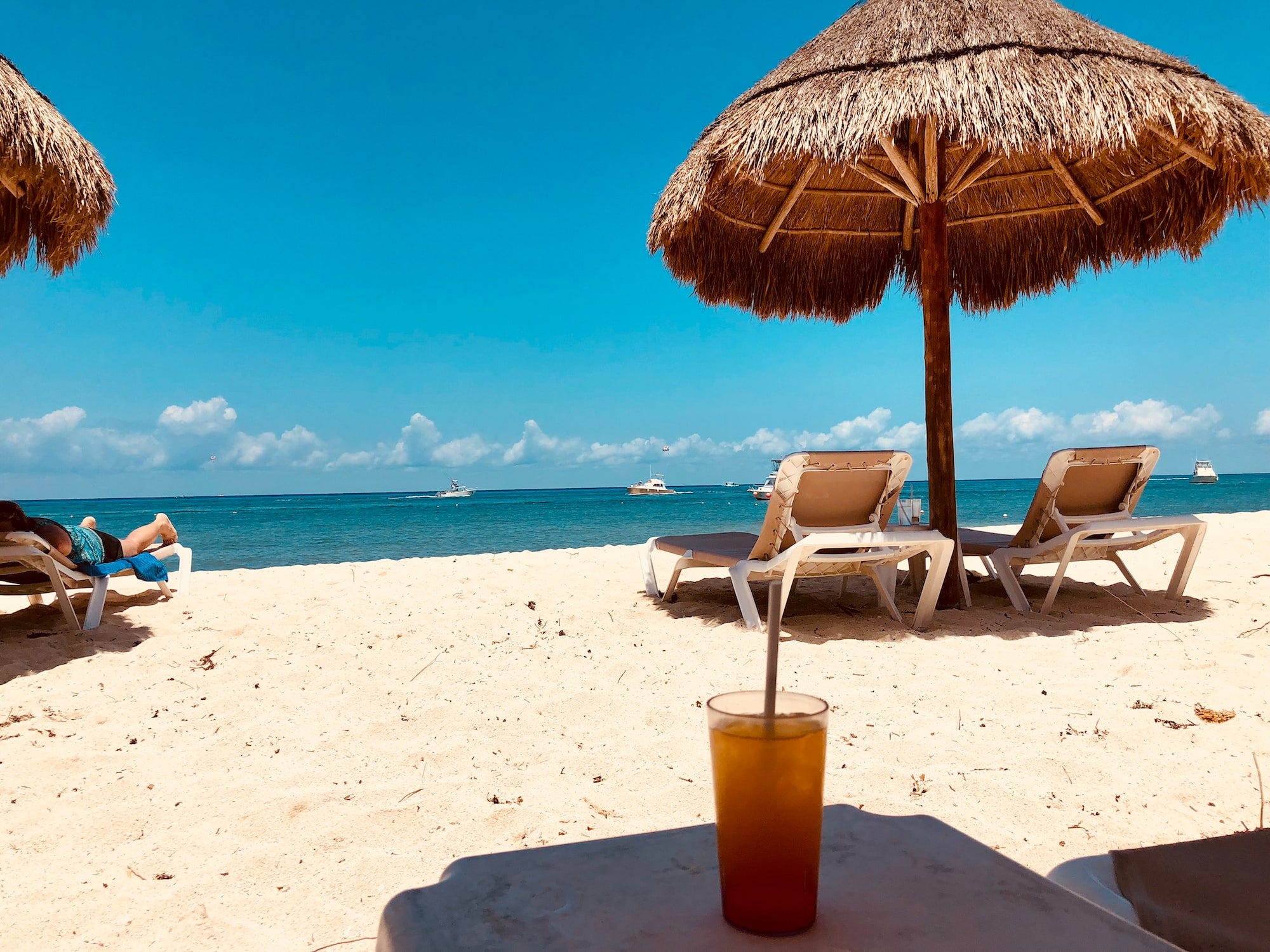 A beach with sun shades