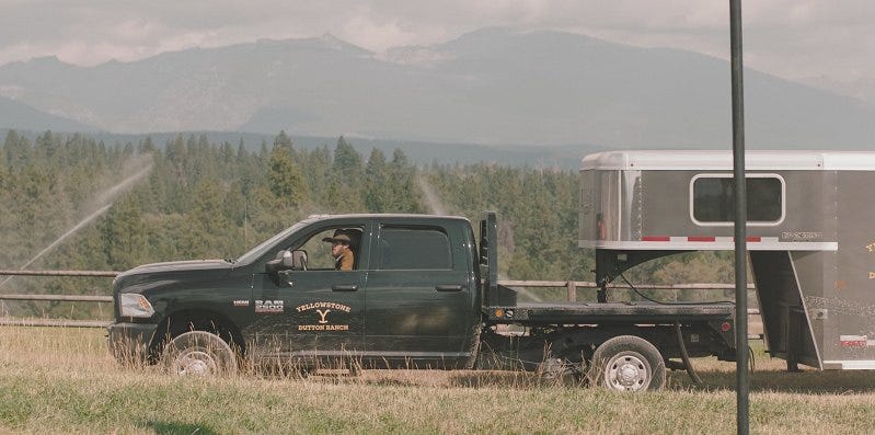 Some of the cowboys of the Yellowstone Dutton Ranch leaving with cattle to take them to leased pastures