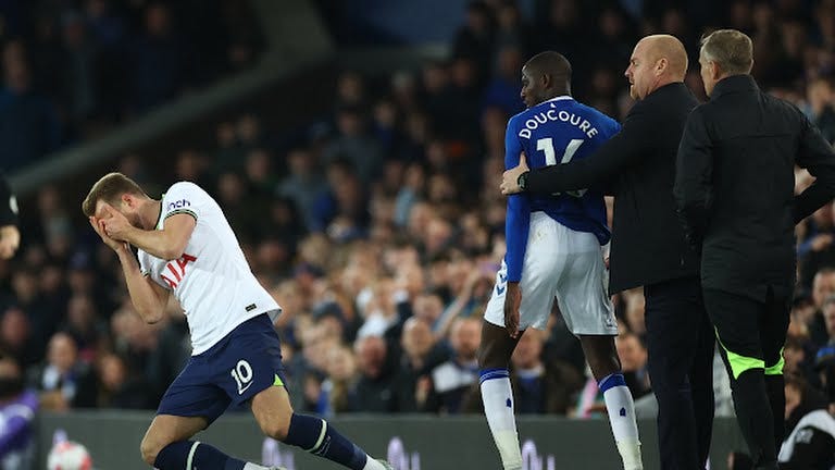 Everton's Doucoure after hitting Harry Kane in the face