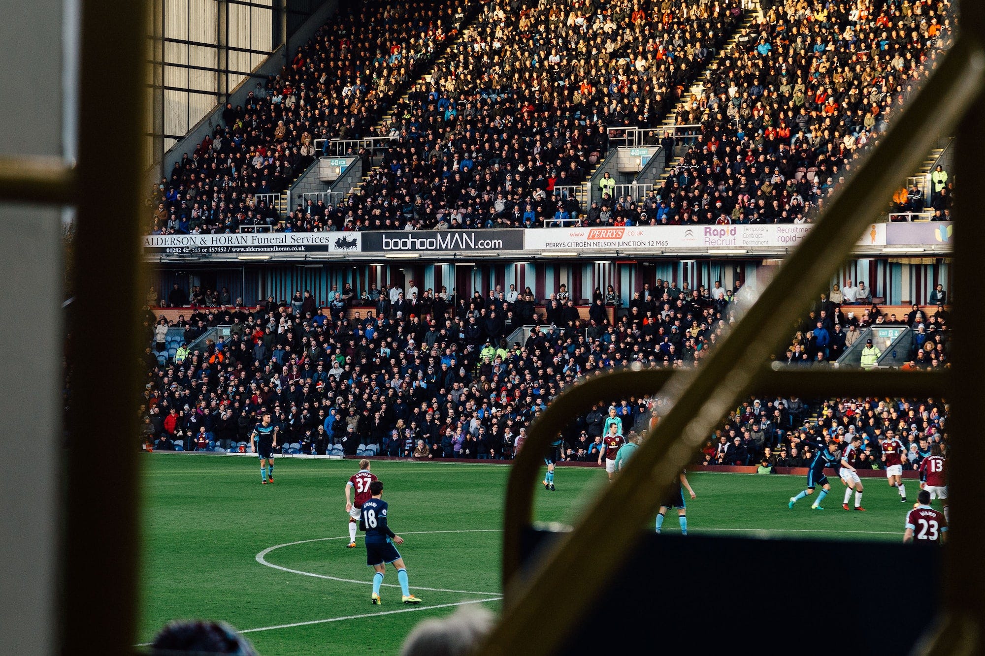 Players playing in the English Premier League from the view of a fan 