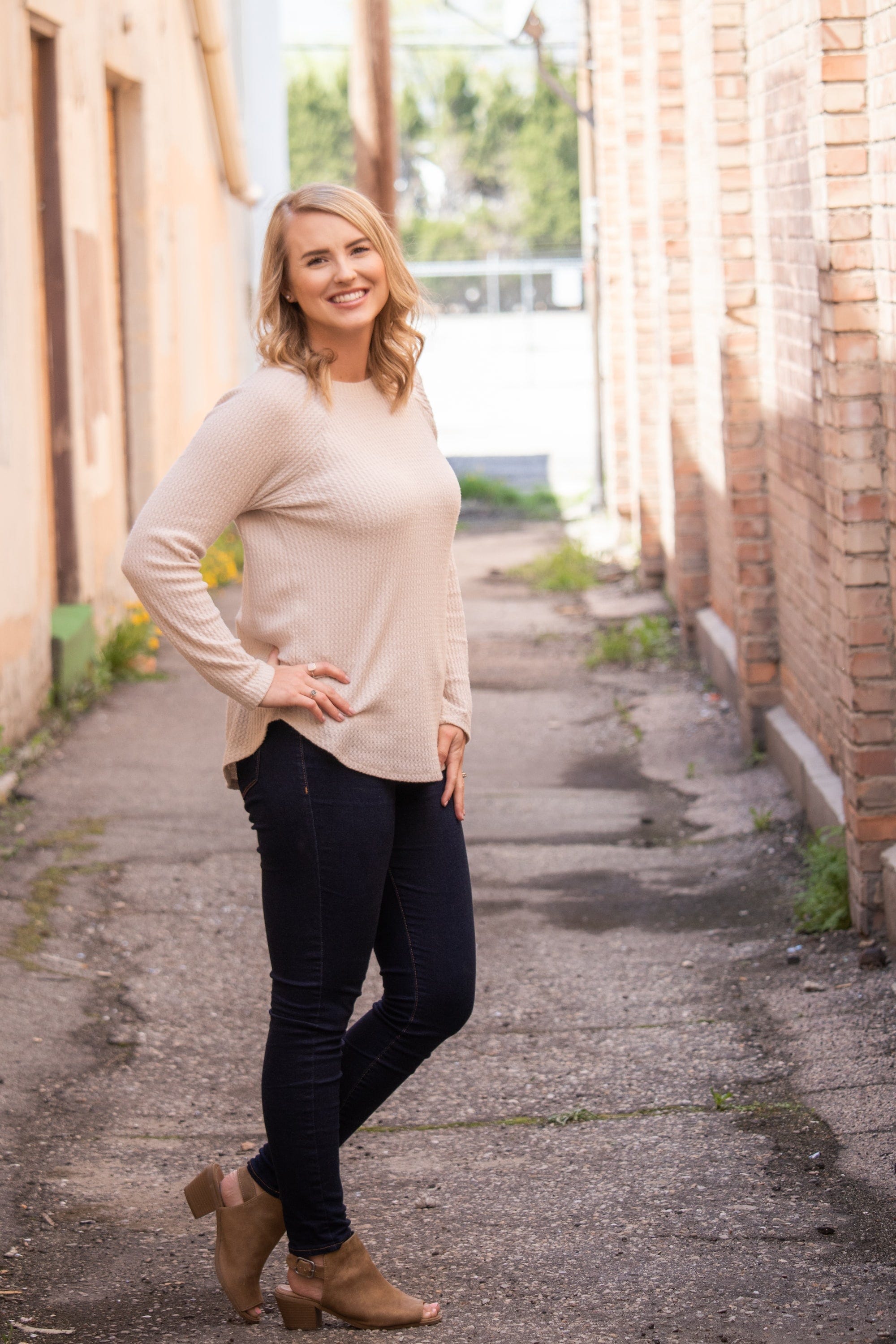 A woman wearing light-colored and loose clothing which can help prevent mosquito bites by reducing areas where your skin is exposed