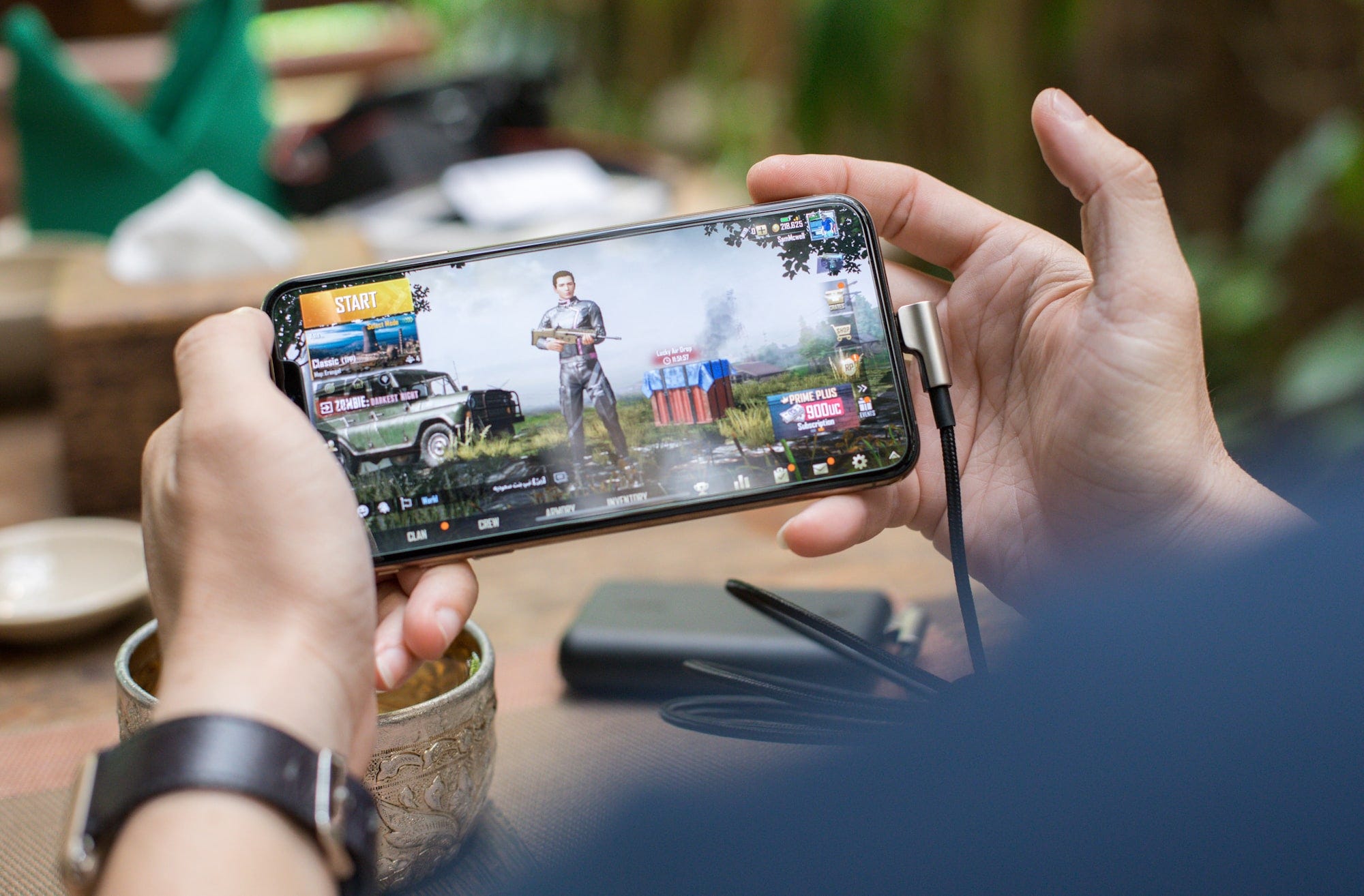 An individual Playing Pubg Game On Smartphone