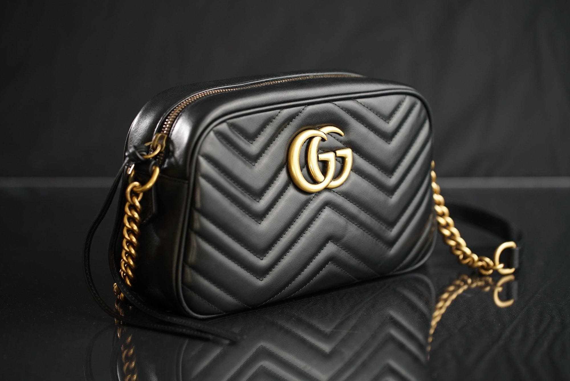 A black Gucci designer bag