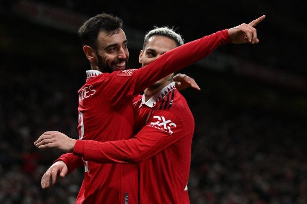 Bruno Fernandes celebrating his goal against Fulham with teammate Antony