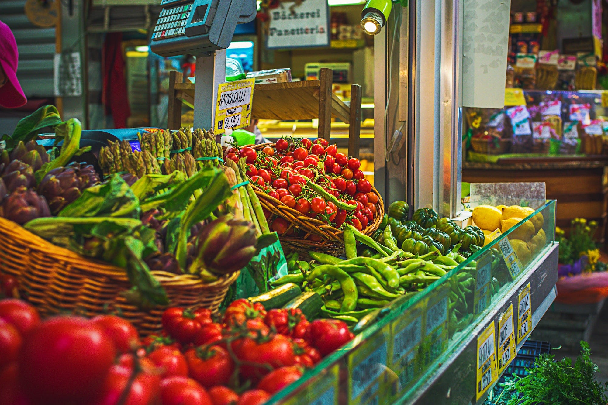 Numerous vegetables including legumes in a market stall