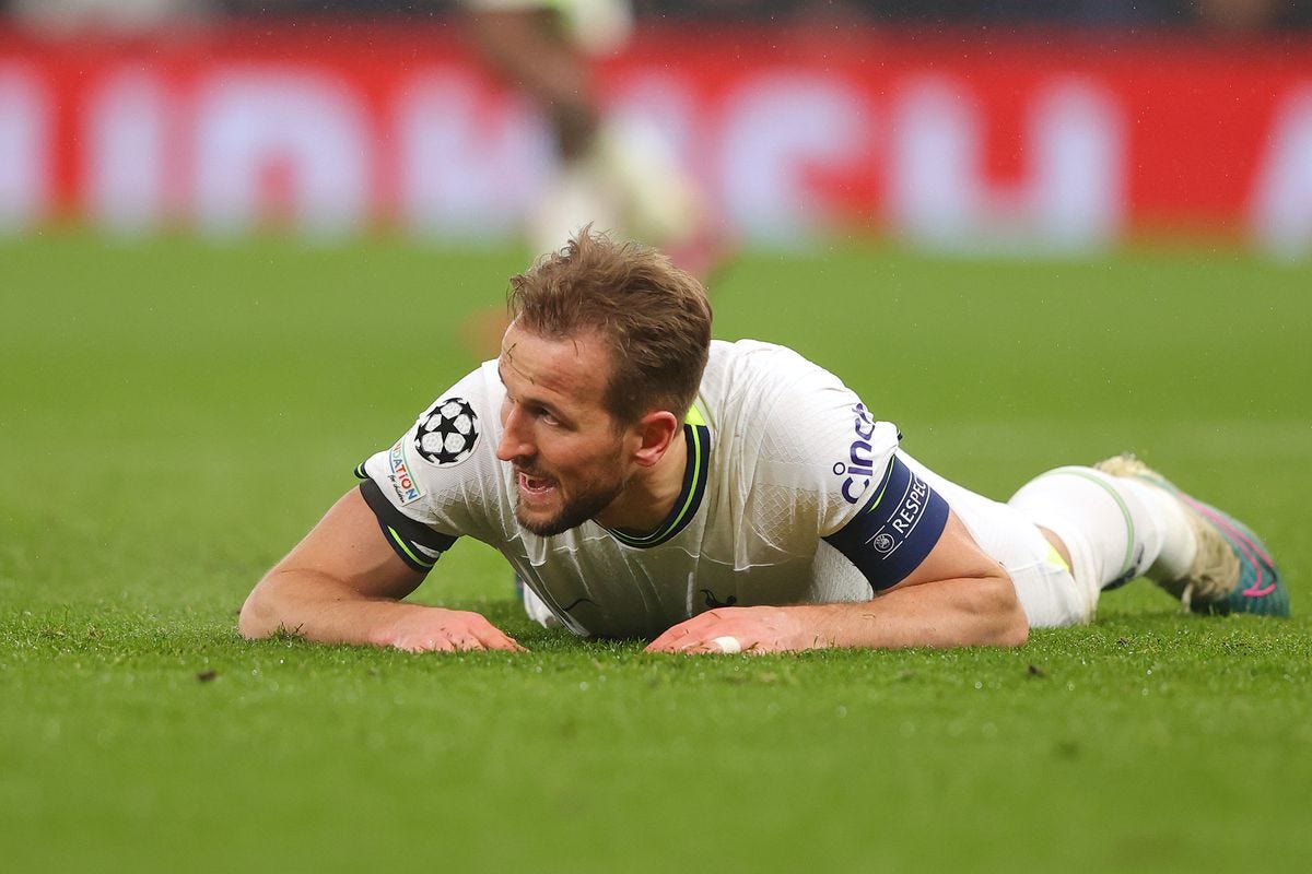 Spurs' Harry Kane lying on the pitch seemingly in dismay