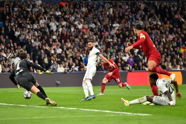 Vinicius Jr. the moment he passes the ball to Benzema who then scores in their UCL Round of 16 Leg 2 game against Liverpool