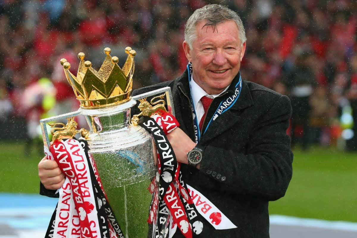 Sir Alex Ferguson holding the English Premier League Trophy