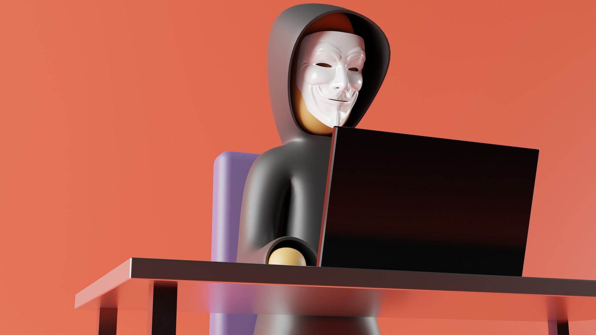 An image of an anonymous figurine wearing the anonymous mask while operating a laptop