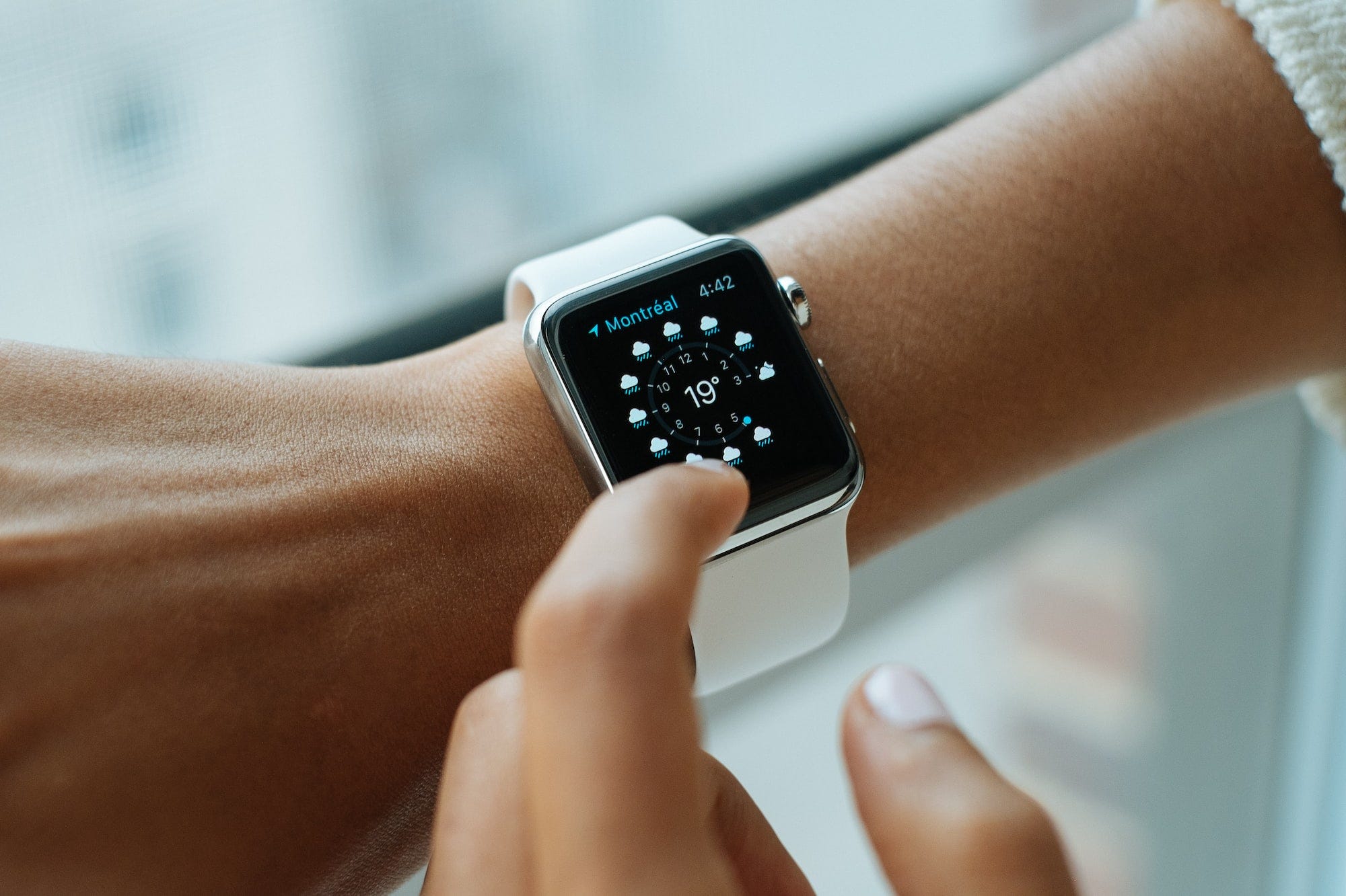 A woman using the Apple Watch on her wrist