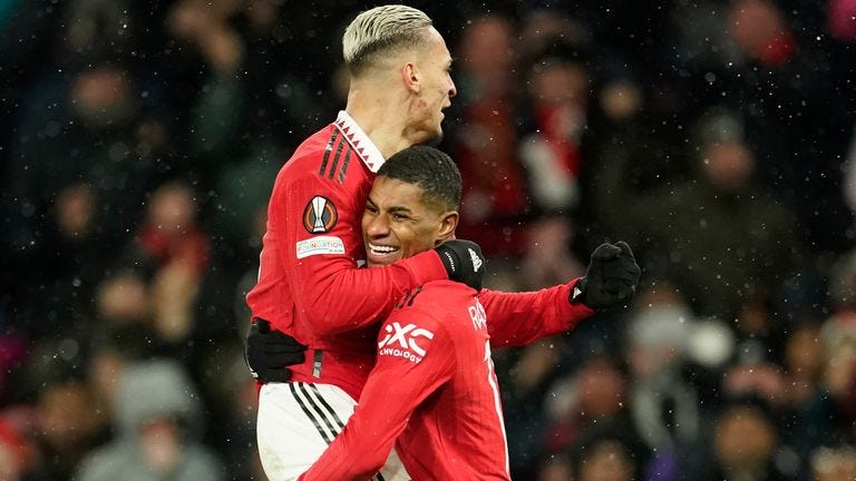 Man United's Antony celebrating his goal with Marcus Rashford who's carrying him