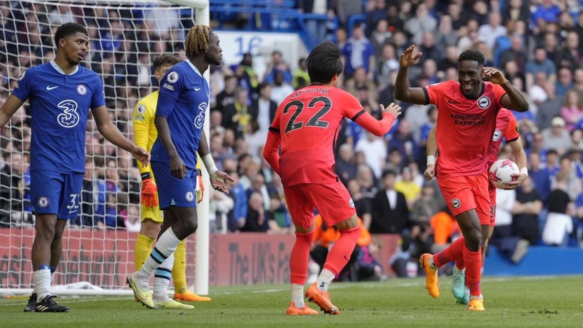 Brighton's Danny Welbeck celebrated his goal against Chelsea with a teammate as Chelsea players watch on