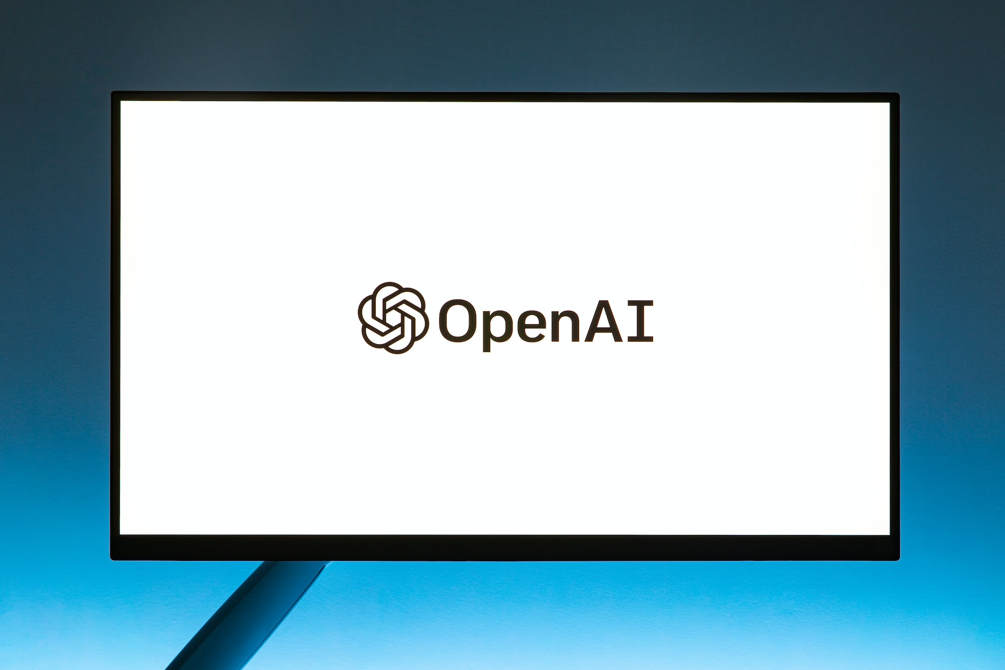 A computer screen with the OpenAI logo and name displayed