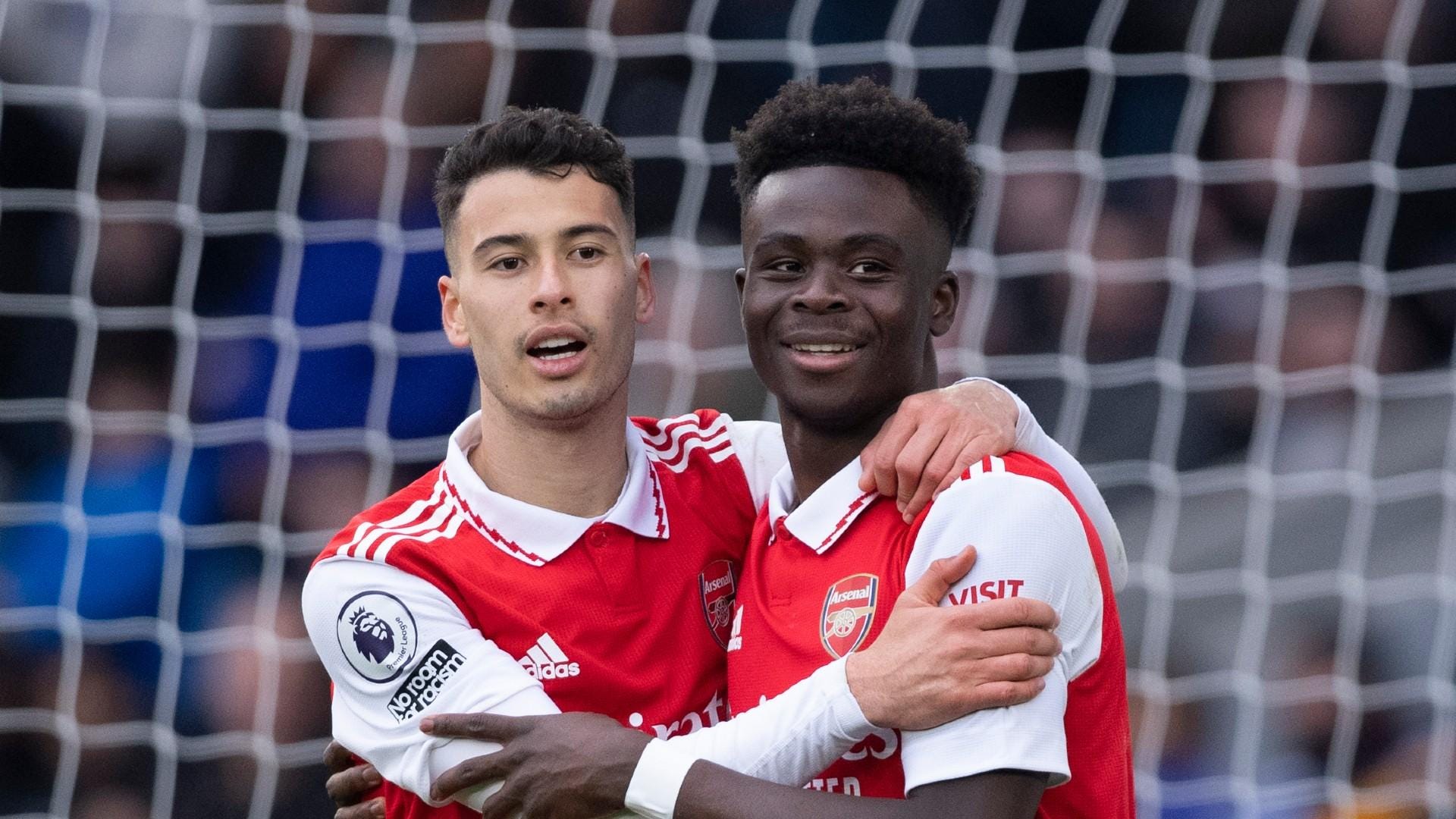 Arsenal players Martinelli and Saka celebrating a goal against Everton