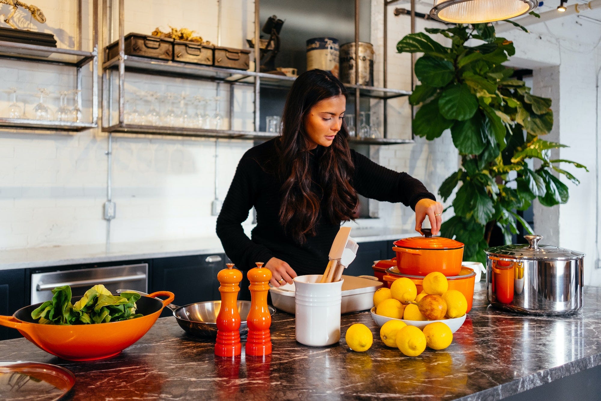 A woman in the kitchen preparing a meal