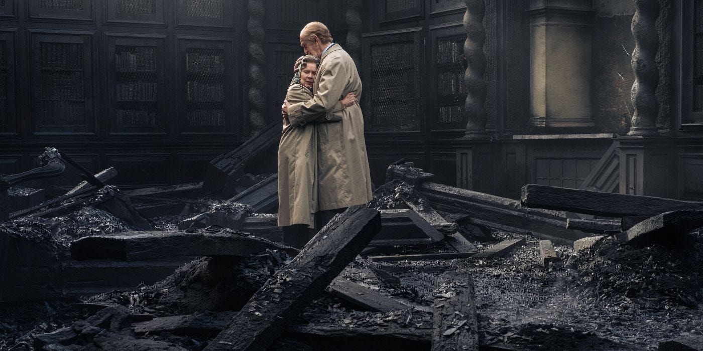 Prince Philip comforts Queen Elizabeth in the ruins of Windsor Castle after a fire