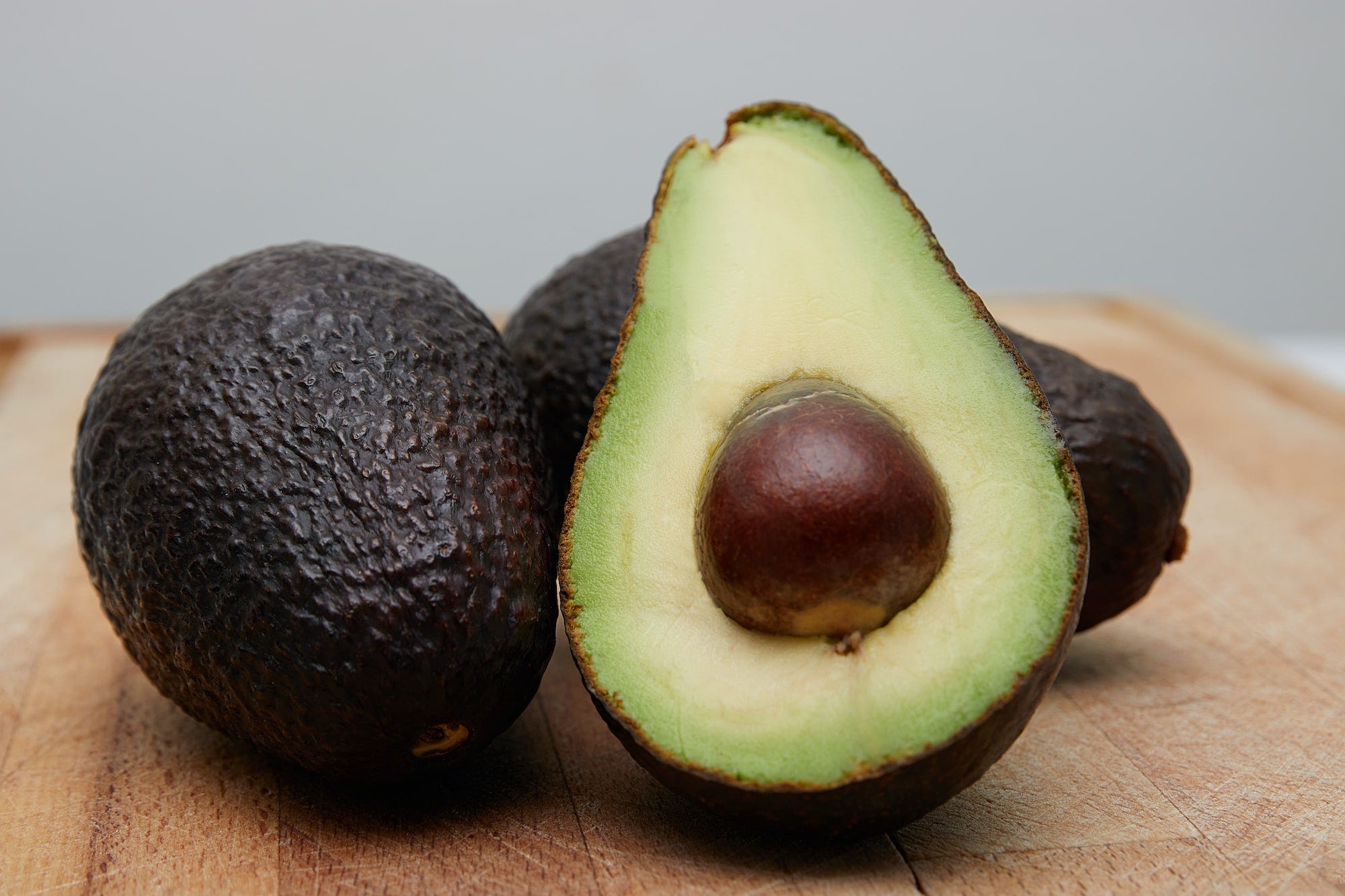 Freshly cut avocados. Heating can be used as a way to ripen avocados fast but isn't the best option