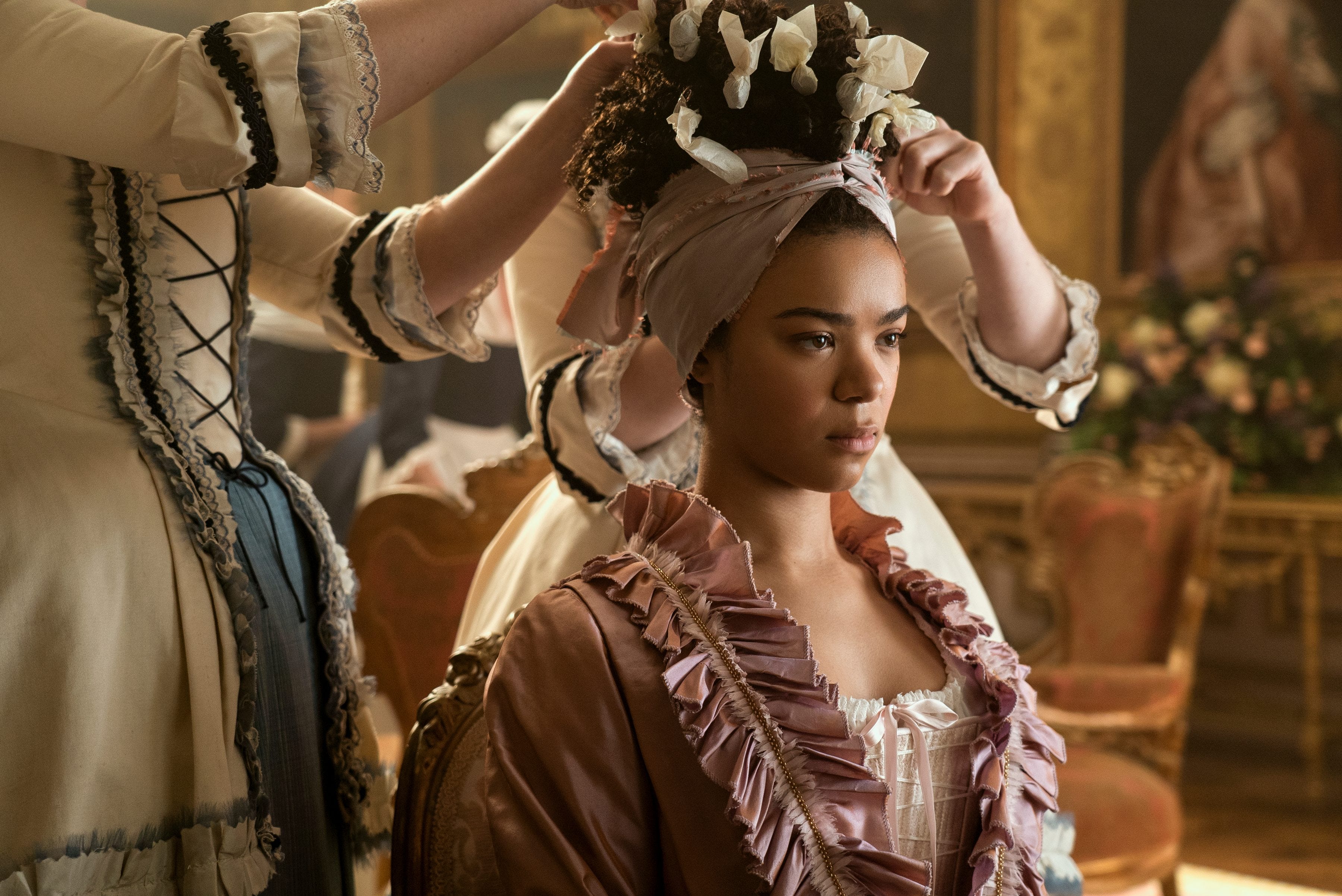 Queen Charlotte quickly becomes accustomed to the pampered life and being waited on | Queen Charlotte Review | Mania Movies