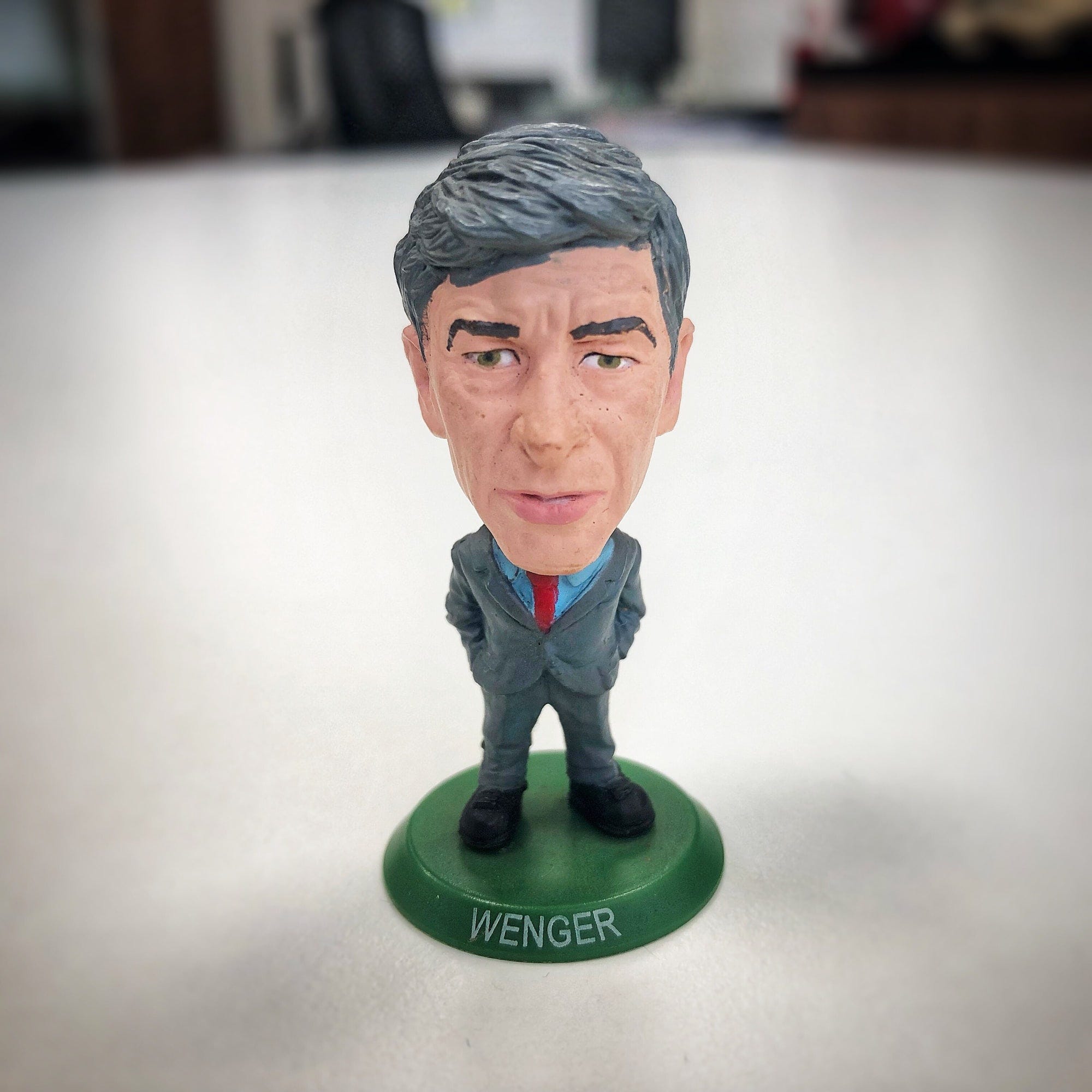 A figurine of former Arsenal coach Arsène Wenger