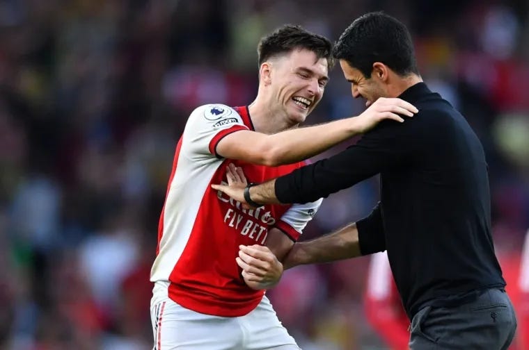 Kieran Tierney and his coach Mikel Arteta having a moment of laughter