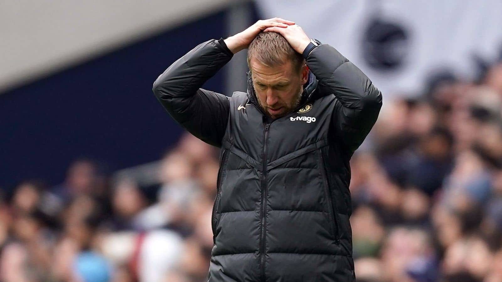 Chelsea coach Graham Potter holding his head in apparent disappointment on losing to Tottenham in the EPL