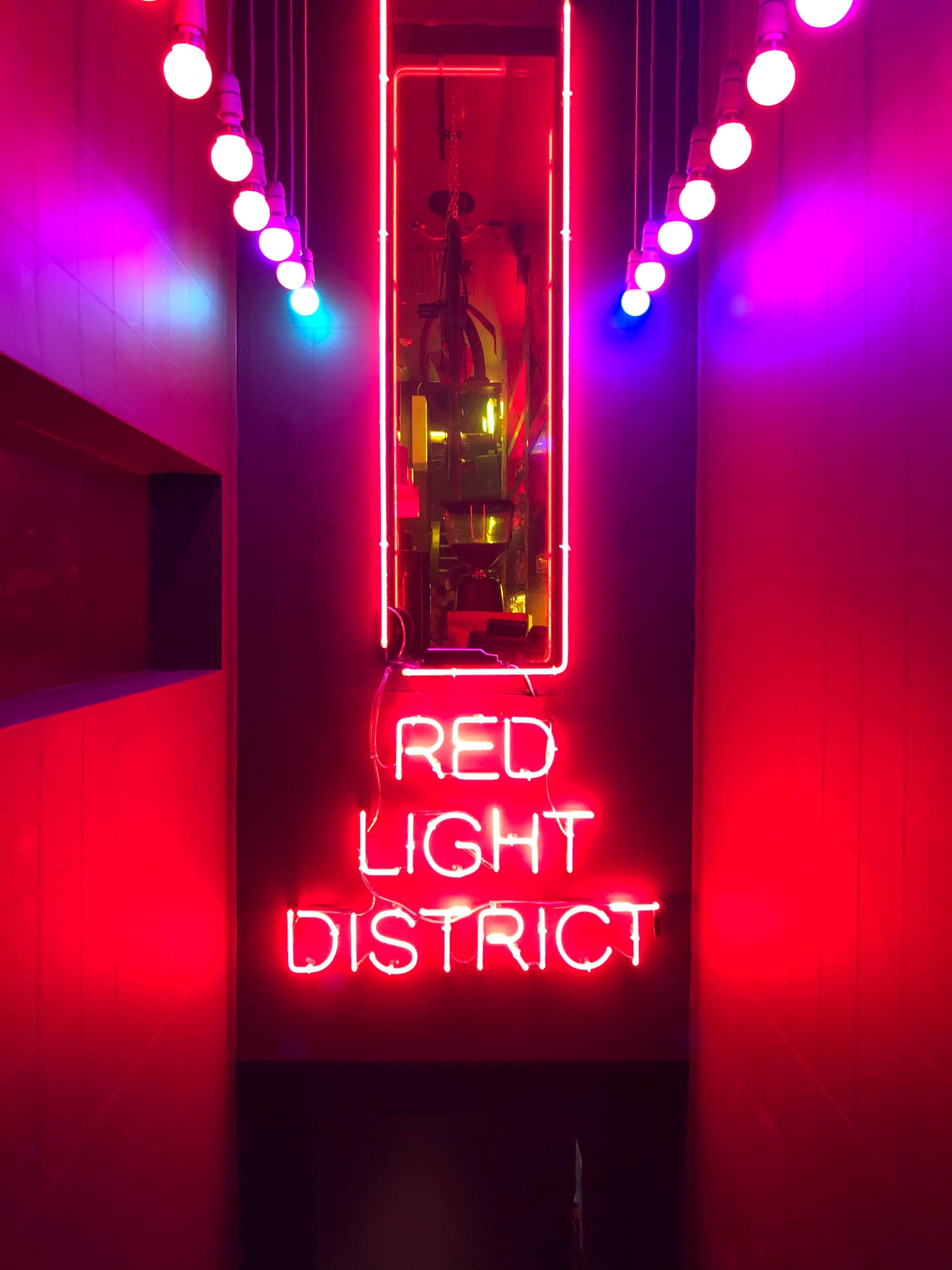 A bar in Glasgow with a neon sign reading Red Light District