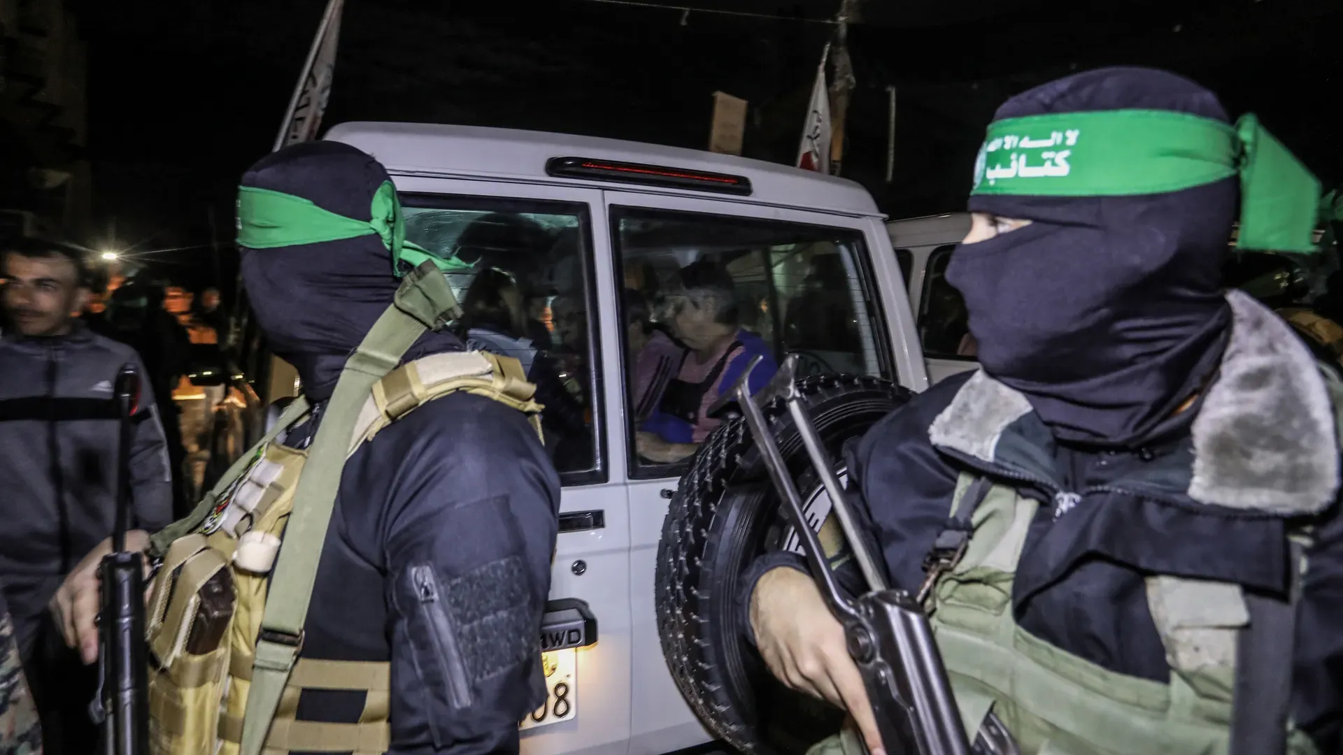 Hamas militants during a past release of Oct 7 hostages | Fresh Round of Ceasefire Talks Amidst Israel-Gaza Conflict: A Glimpse of Hope or Prolonged Suffering? | Mania Politics