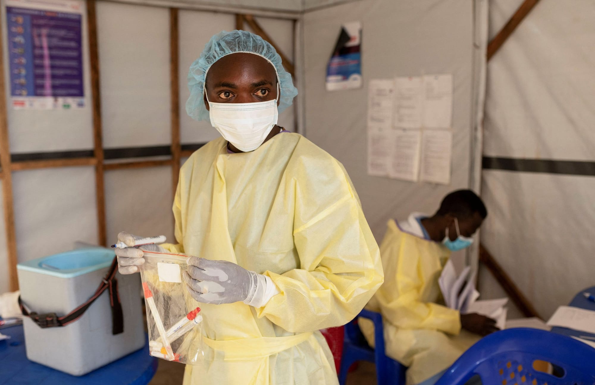 A health worker handling samples for testing in DRC | W.H.O Declares Mpox a Global Health Emergency: Critical Facts You Need to Know | Mania Health