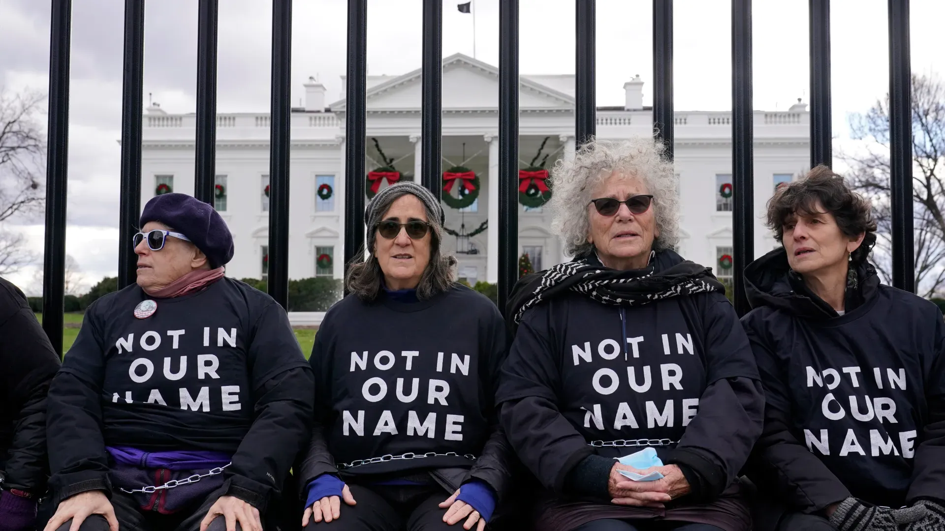 Jewish protestors outside parliament calling for an end to the Israeli-Palestinian conflict wearing t-shirts branded 'Not In Our Name' | Israelism Documentary Review | Mania Movies