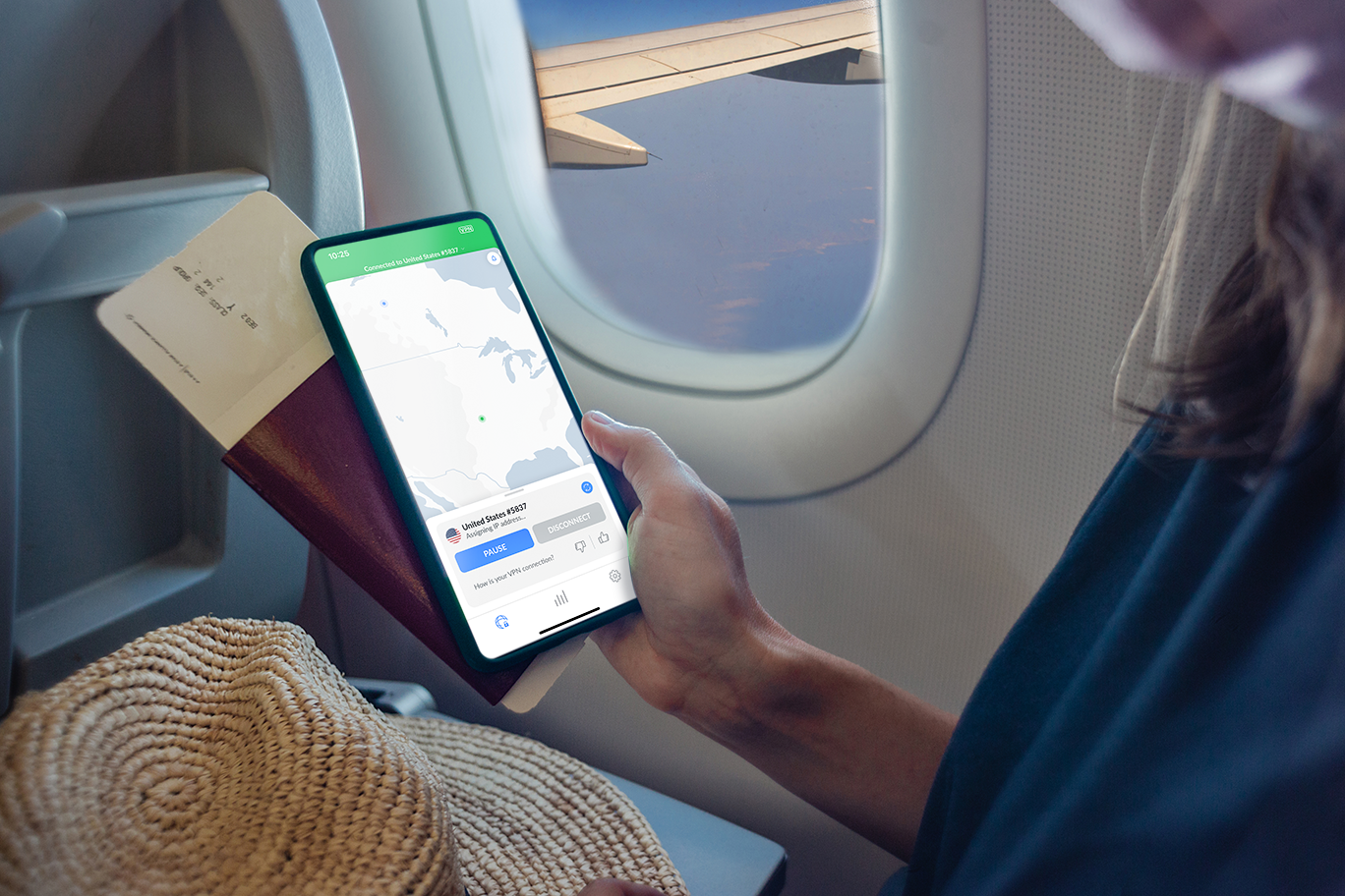 A woman connecting to NordVPN on the iPhone on a plane | Unlock Seamless Connectivity: Why You Need Saily and NordVPN for Paris Olympics 2024  | Mania Deals