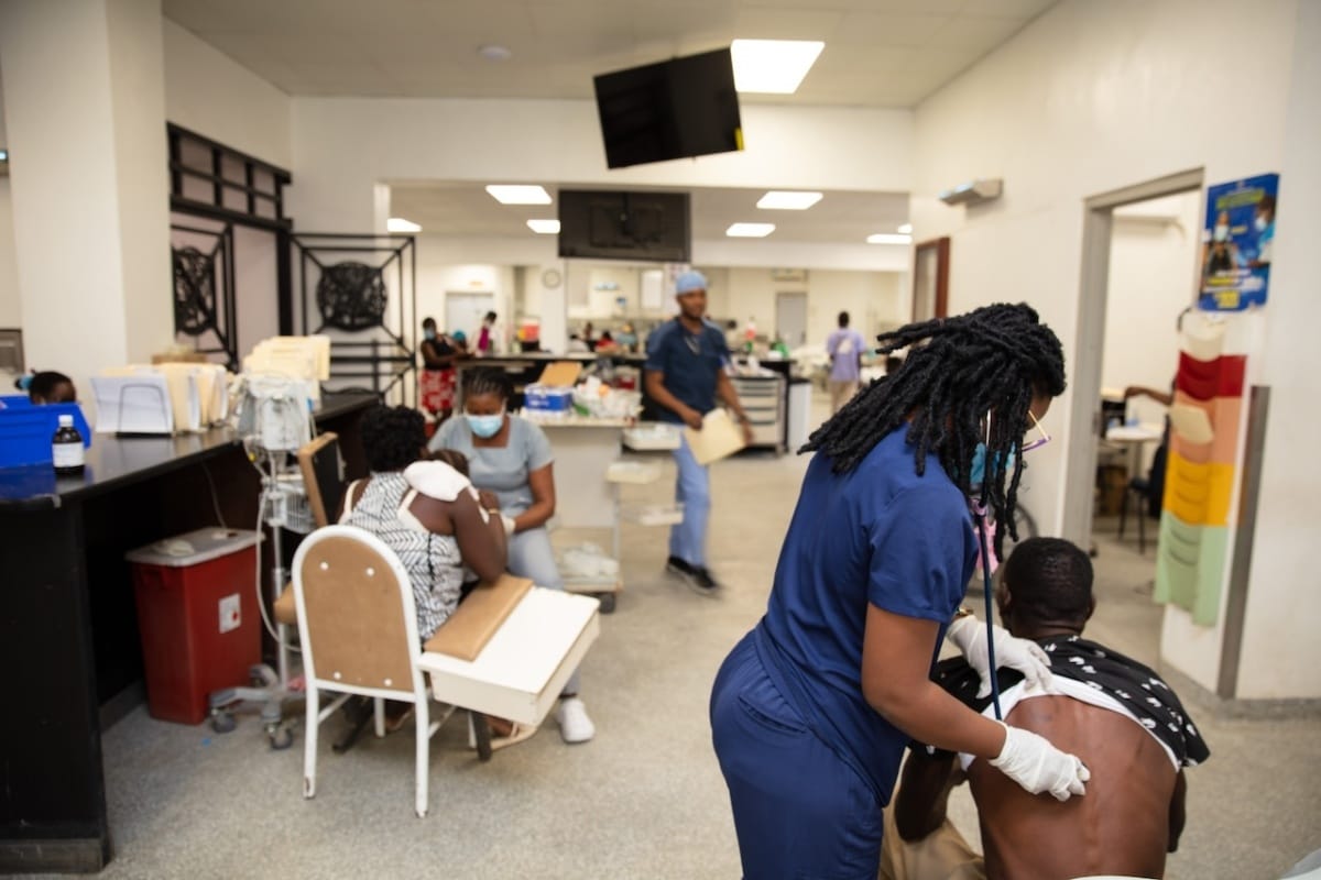 A doctor assessing a patient in Haiti | Potential Solutions to the Crisis in Haiti | Featured Stories on Mania Africa