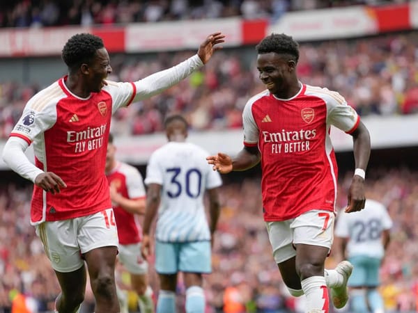 Nketiah and Saka celebrating a goal