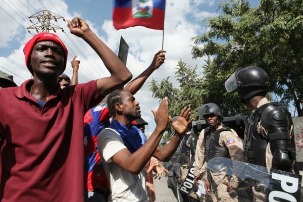 People protesting in Haiti | Gangs and Insecurity: Investigating the Root Causes of Instability in Haiti | Mania Africa