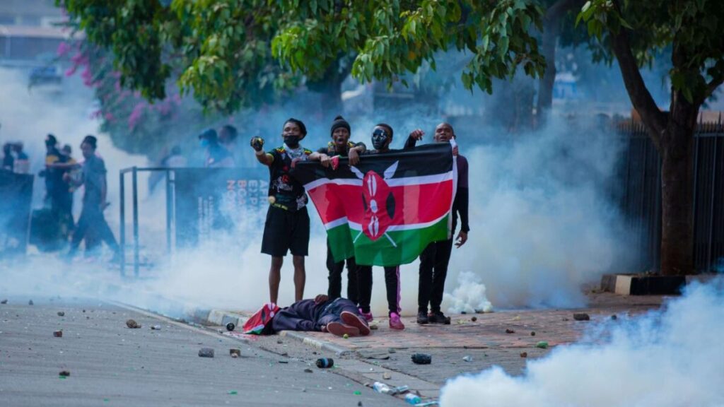 Unmasking the Killers: BBC Africa Eye’s ‘Blood Parliament’ Exposes Fatal Shootings During Kenya Finance Bill Protests 3 | Mania Africa | maniainc.com Gen Z protestors holding a flag above the body of slain Gen Z hero, David Chege during June 25th protests | Mashujaa Day 2024 - Celebrating slain Gen Z protestors | Mania News | maniainc.com/news