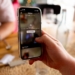 A phone showing the TikTok App with content censored - Unveiling TikTok's Alleged Anti-Trump Censorship – What Users Need to Know