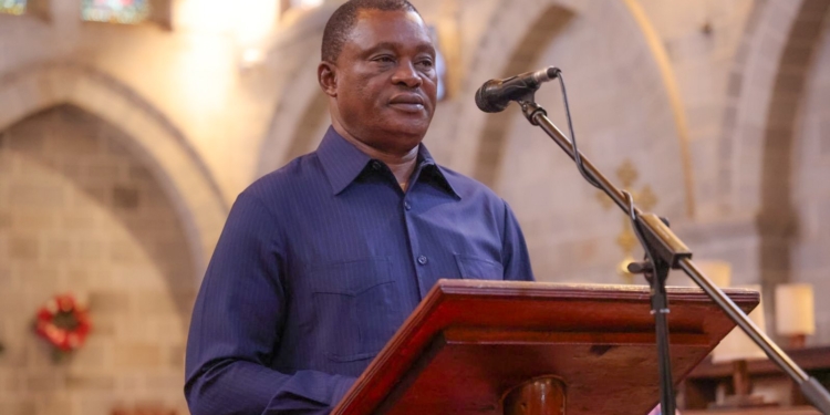 Kenyan Minister for Public Service, Justin Muturi, during a church service days following his explosive revelation that his son had been abducted