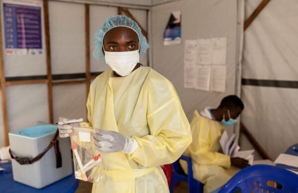 W.H.O Declares Mpox a Global Health Emergency: Critical Facts You Need to Know 3 | Mania Africa | maniainc.com A health worker handling samples for testing in DRC | W.H.O Declares Mpox a Global Health Emergency: Critical Facts You Need to Know | Mania Health